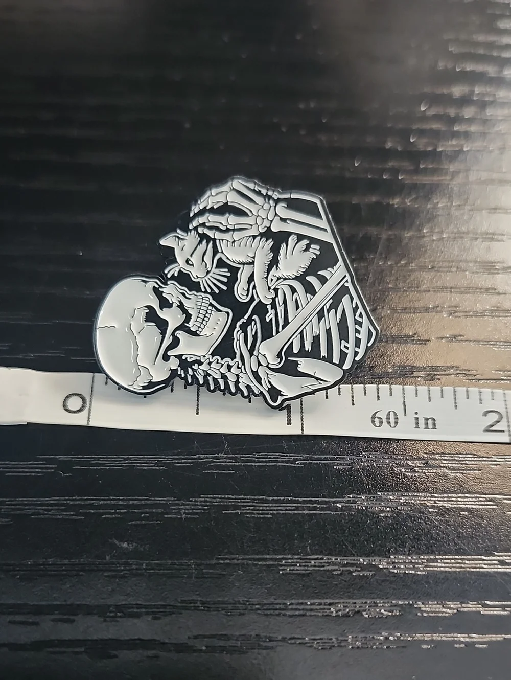 Black & White Skeleton Holding Cat Enamel Pin